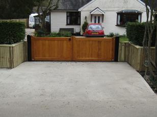 Flood Divert straight top gates in Accoya and treated with Sikkens Light Oak